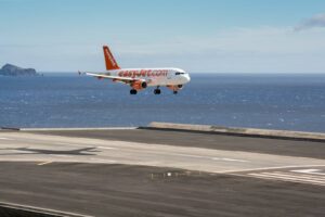NOV 13: A passenger aircraft operated by easyJet arrives at Funchal Airport in Madeira, Portugal on November 13, 2014.